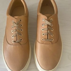 Sneakers size 7, runs small. Tan.